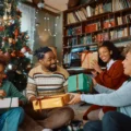 multi generation family exchanging christmas gifts 1
